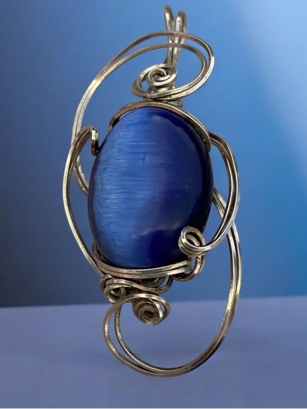Sterling Silver wire wrapped blue cat’s pendant